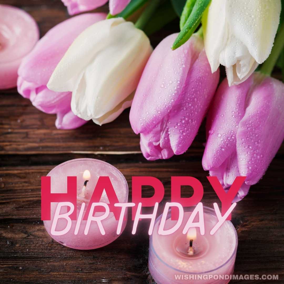 Pink and white tulips and candles on the wooden table - Happy Birthday Flower Images